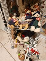 Full view of wire rack with stuffed animals on two shelves