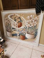 Full view of large framed painting leaning against wall