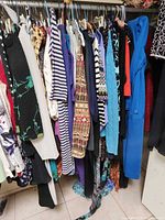Full clothing rack with assorted garments