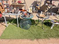 Wide view showing four tables and decor pieces