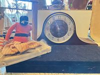 Overall lot showing clock, loom, doll, display board