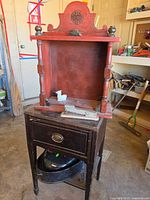 Overall lot showing side table, red shelf on top, roaster underneath