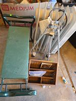 Overall lot view: bench, heaters, easel, basket