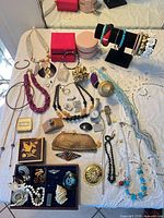 Overview of entire jewelry lot on table