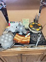 Assortment of kitchen items placed on stovetop