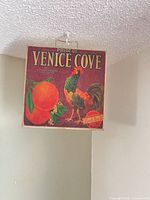 Front view of square wall art showing full graphic and hanging chain