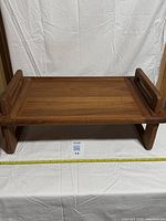 Top view of teak tray showing overall design and legs