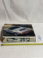 Top view of Fujimi Porsche 911 Carrera Speedster model kit box with measuring tape