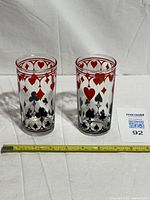 Both poker theme tumblers with measuring tape visible