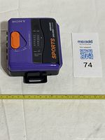 Front view showing model label, AM/FM scale, Mega Bass marking, overall colour scheme