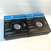 Front view of two boxed AblePlanet Clear Harmony NC1000CHA headphones