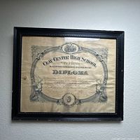 Front view of framed diploma showing entire item and condition