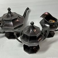 Full view of three-piece tea set showing design and condition