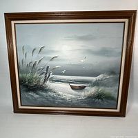 full view of framed seascape art