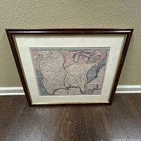 Front view of framed historic U.S. map showing frame, mat, and glass