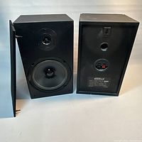 Front and rear view of both KLH B-PRO6 speakers with one grille removed