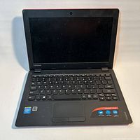 Laptop open showing screen, keyboard layout and overall condition