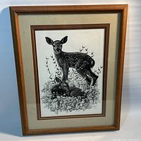 Full view of framed print showing image, matting, and frame