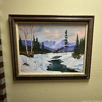 Front view of the framed winter mountain river landscape painting