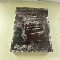 Full view of vertical canvas print on wall showing vintage typewriter image