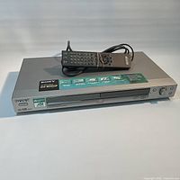 Front view of Sony DVP-NS425P player with remote on top