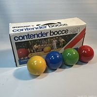 Full set showing four balls in front of Sportcraft Contender box