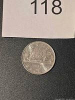 Reverse of 1986 Canadian silver dollar showing canoe scene and inscriptions