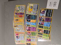 All 49 Pokémon holo and reverse holo cards laid out in two groups