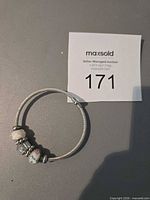 Full bracelet laid flat showing all charms