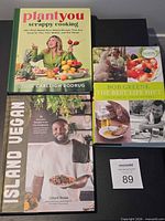 All three cookbooks laid out: PlantYou, Island Vegan, Best Life Diet