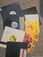 Group of eight 12" singles with various picture and plain sleeves