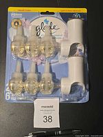 Front view of sealed Glade PlugIns value pack showing six refills and two warmers