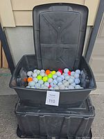Overall view of tote filled with golf balls