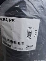 Label on carry bag showing IKEA PS branding and product sketch