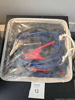Full view of jumper cables in clear zip bag