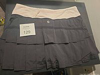 Front view of Lululemon skort showing pleated design and waistband