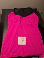 Front view of pink Lululemon tank top laid flat