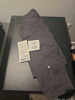 Folded leggings showing color, logo, and hang tag