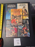 Front covers of the five Hardy Boys books showing three legible titles