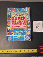 Front cover of Pokémon Super Deluxe Essential Handbook
