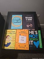 All five books displayed on tabletop