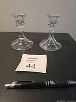 front view of both glass candlestick holders