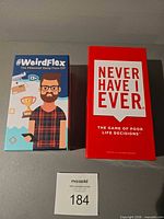 Both boxed card games side by side