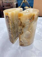 Front view of both onyx bookends showing polished faces