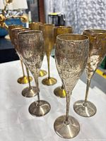 Group of eight silver-plated champagne flutes