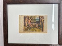 Full view of framed postcard under glass