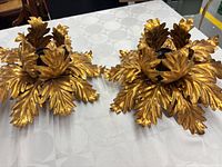 Pair of gilt metal leaf fixtures top view