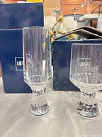 Two Mikasa Broadway glasses in front of branded boxes