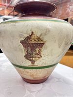 Full view of Murano vase showing shape, painted decoration, and color bands