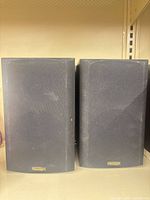 Front view of both Paradigm bookshelf speakers with grilles attached